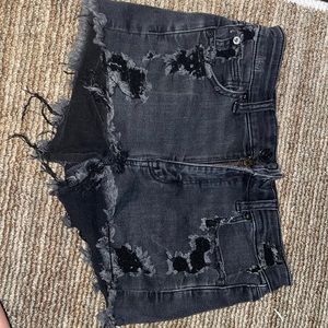 black ripped ae jean shorts